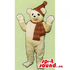 Beige Teddy Bear Mascot Dressed In A Winter Hat And Scarf