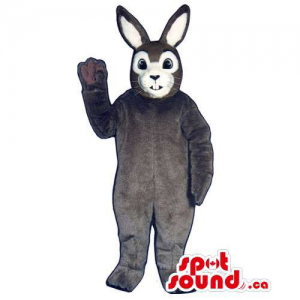 Brown Rabbit Mascot With A White Face Dressed In Overalls