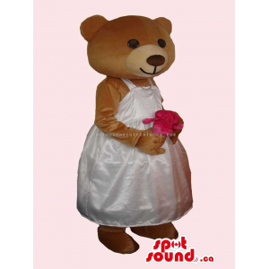 Brown Bear Girl Mascot With Flower Dressed In A White Dress